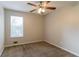 Comfortable bedroom with ceiling fan, large window for natural light, and neutral carpeting at 3851 Natalie Way, Ellenwood, GA 30294