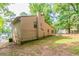 Back exterior view of a single Gathering home, showing the back yard at 3851 Natalie Way, Ellenwood, GA 30294