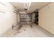 Attached garage with an automatic door, concrete floor and overhead storage at 3851 Natalie Way, Ellenwood, GA 30294