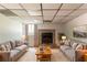 Cozy living room with a stone fireplace, plush rug, and comfortable seating arrangement at 3851 Natalie Way, Ellenwood, GA 30294