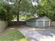 Two-car garage with concrete parking area and a fenced in yard at 644 Albert Nw St, Atlanta, GA 30318