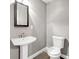 Small, bright bathroom with a modern pedestal sink and low-flow toilet at 644 Albert Nw St, Atlanta, GA 30318