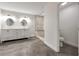 A modern bathroom featuring a double vanity, a tiled shower, and contemporary fixtures at 644 Albert Nw St, Atlanta, GA 30318
