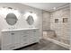 Bathroom featuring double sink vanity, tile floors, and a tile shower with a built-in bench at 644 Albert Nw St, Atlanta, GA 30318