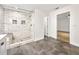 A bathroom featuring a tiled shower with a built-in bench and shampoo niches at 644 Albert Nw St, Atlanta, GA 30318
