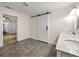 Bathroom featuring a double sink vanity, tile floors, and a sliding barn door at 644 Albert Nw St, Atlanta, GA 30318