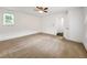 Bright bedroom featuring carpet, and a view into an adjacent room at 644 Albert Nw St, Atlanta, GA 30318