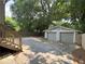 Two-car garage with concrete parking area and a fenced in yard at 644 Albert Nw St, Atlanta, GA 30318