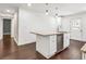 Modern kitchen with granite countertop island, stainless steel dishwasher, and stylish pendant lighting at 644 Albert Nw St, Atlanta, GA 30318