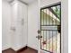 Clean mud room featuring a built-in cabinet and a black metal security door leading to the back yard at 644 Albert Nw St, Atlanta, GA 30318