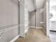 A well-organized walk-in closet with shelving and storage, adjacent to a modern bathroom at 644 Albert Nw St, Atlanta, GA 30318