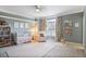Cozy Bedroom with crib, plush chair, soft colors, and natural light at 1040 Emory Parc Pl, Decatur, GA 30033