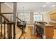 Open concept kitchen and dining area with hardwood floors and stainless steel appliances at 1040 Emory Parc Pl, Decatur, GA 30033