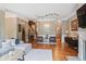 Open-concept living room with hardwood floors, plush seating, and access to the staircase at 1040 Emory Parc Pl, Decatur, GA 30033