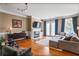 Inviting living room featuring hardwood floors, fireplace, and modern decor at 1040 Emory Parc Pl, Decatur, GA 30033