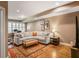 Cozy living room with a large sectional sofa, area rug, and hardwood flooring at 1040 Emory Parc Pl, Decatur, GA 30033