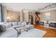 Spacious living room with hardwood floors, a sectional sofa, and stylish decor at 1040 Emory Parc Pl, Decatur, GA 30033