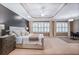 Spacious main bedroom featuring neutral tones, tray ceiling, and large windows at 1040 Emory Parc Pl, Decatur, GA 30033