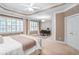 Large main bedroom featuring many windows, natural light, neutral tones and an attached desk area at 1040 Emory Parc Pl, Decatur, GA 30033