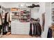Organized walk-in closet with shelving, drawers, and hanging storage at 1040 Emory Parc Pl, Decatur, GA 30033