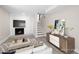 Finished basement with a modern fireplace, entertainment center, and neutral color palette at 1120 Taliwa Ne Trl, Marietta, GA 30068