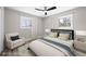 Bright bedroom with large windows, soft carpet, and a comfortable bed with stylish accent pillows at 1120 Taliwa Ne Trl, Marietta, GA 30068