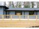 A close up of the house with a newly constructed front porch with a modern door at 1120 Taliwa Ne Trl, Marietta, GA 30068