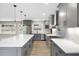 Updated kitchen with large island, stainless steel appliances, and quartz countertops at 1120 Taliwa Ne Trl, Marietta, GA 30068