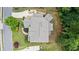 An aerial view showing the roof, landscaping and outdoor living spaces of this well-maintained home at 1980 Marcia Overlook Dr, Cumming, GA 30041