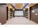 Finished basement theater featuring a large projector screen, offering a luxury space for movie nights and entertainment at 1980 Marcia Overlook Dr, Cumming, GA 30041