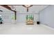 Spacious finished basement featuring light walls and a comfortable seating area, ready for customization and entertainment at 1980 Marcia Overlook Dr, Cumming, GA 30041