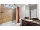 Elegant bathroom featuring a shower-tub combo and a granite vanity, offering a blend of style and functionality at 1980 Marcia Overlook Dr, Cumming, GA 30041