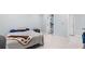 Minimalist bedroom with a view to a tiled bathroom at 1980 Marcia Overlook Dr, Cumming, GA 30041