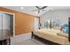 Inviting bedroom with a ceiling fan, carpeted floor, and a bright window at 1980 Marcia Overlook Dr, Cumming, GA 30041