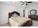 Cozy bedroom with a ceiling fan, carpeted floor, and a walk-in closet at 1980 Marcia Overlook Dr, Cumming, GA 30041