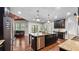 Bright, open kitchen with a large island, stainless steel appliances, and modern finishes at 1980 Marcia Overlook Dr, Cumming, GA 30041