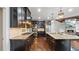 Gourmet kitchen with stainless appliances, stone countertops and an island with seating at 1980 Marcia Overlook Dr, Cumming, GA 30041