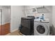 Well-equipped laundry room with modern washer and dryer, offering convenience for everyday chores at 1980 Marcia Overlook Dr, Cumming, GA 30041