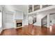 Open floor plan features a fireplace, built-ins, soaring ceilings, and staircase at 1980 Marcia Overlook Dr, Cumming, GA 30041