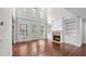 Spacious living room with fireplace, built-ins, soaring ceilings and large windows at 1980 Marcia Overlook Dr, Cumming, GA 30041
