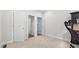 Spacious office space featuring neutral walls, plush carpet, and multiple entryways for accessibility at 1980 Marcia Overlook Dr, Cumming, GA 30041