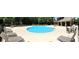 A community pool features lounge chairs, tables, umbrellas, and plenty of room to swim at 1980 Marcia Overlook Dr, Cumming, GA 30041