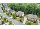A street view of mature landscaping, well maintained lawns, and lovely homes in a beautiful neighborhood at 1980 Marcia Overlook Dr, Cumming, GA 30041