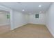 Spacious carpeted basement with recessed lighting and large windows, perfect for recreation or storage at 280 E Valley Dr, Marietta, GA 30068