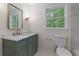 Bathroom features a new vanity, sink, mirror, light fixture, and toilet at 280 E Valley Dr, Marietta, GA 30068