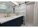Elegant bathroom with double sinks, marble countertops, gold fixtures, and a sliding glass door at 280 E Valley Dr, Marietta, GA 30068