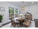 Charming dining room with hardwood floors, a large window, and stylish decor at 280 E Valley Dr, Marietta, GA 30068