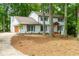 Lovely two-story home with a brick exterior, attached garage, and a professionally landscaped front yard at 280 E Valley Dr, Marietta, GA 30068