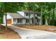 Beautiful two-story home featuring brick accents, a garage, and a well-maintained lawn for enhanced curb appeal at 280 E Valley Dr, Marietta, GA 30068