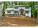 Charming two-story home with a brick exterior, complemented by a welcoming front porch and well-manicured landscaping at 280 E Valley Dr, Marietta, GA 30068